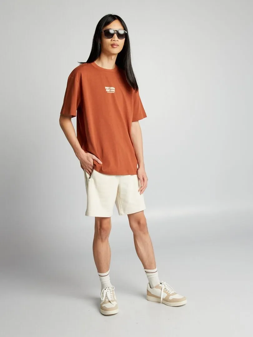 PANTALóN CORTO DE CHáNDAL CON BOLSILLOS CON CREMALLERA  BEIGE