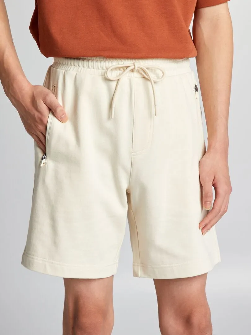 PANTALóN CORTO DE CHáNDAL CON BOLSILLOS CON CREMALLERA  BEIGE